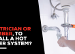 Electrician or plumber to install a hot water system?