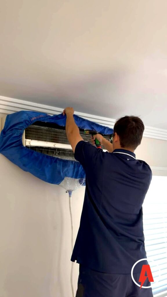 Armitage Electrical technician doing a bag wash chemical clean on a split system air conditioner