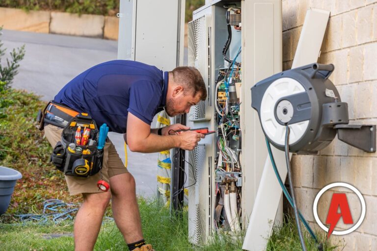 Armitage Electrical electrician servicing a ducted air conditioning outdoor unit