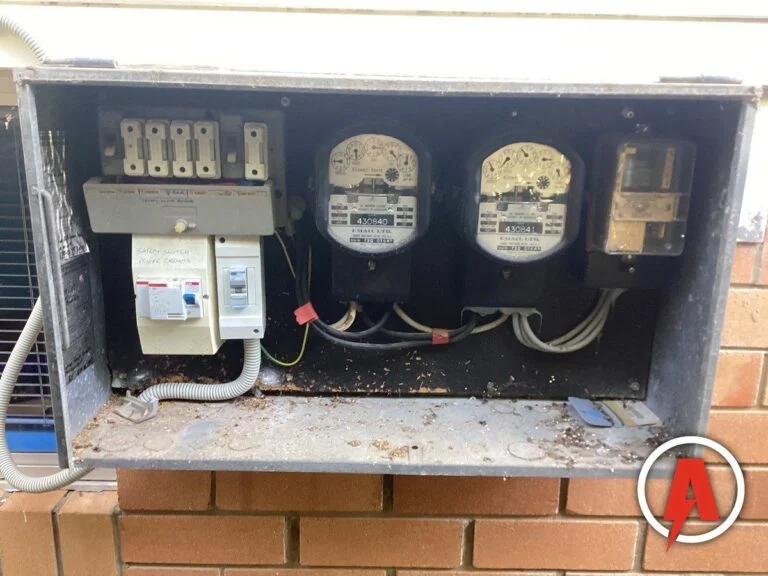Old meter box with ceramic fuses and a single add-on safety switch